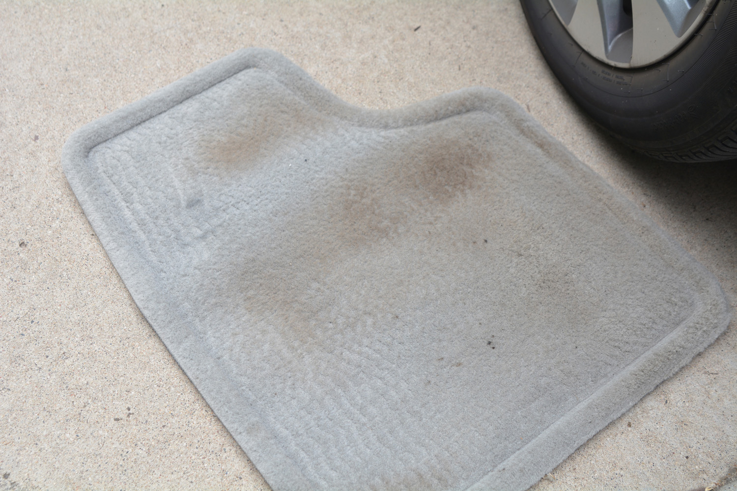 Dirty car floor mat before using Super Clean.