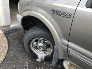 front end of car with dirty tire rim with super clean applied