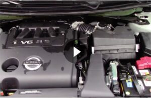 Still picture of engine bay cleaning video with play button