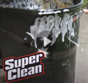 video still of cleaning a garbage can