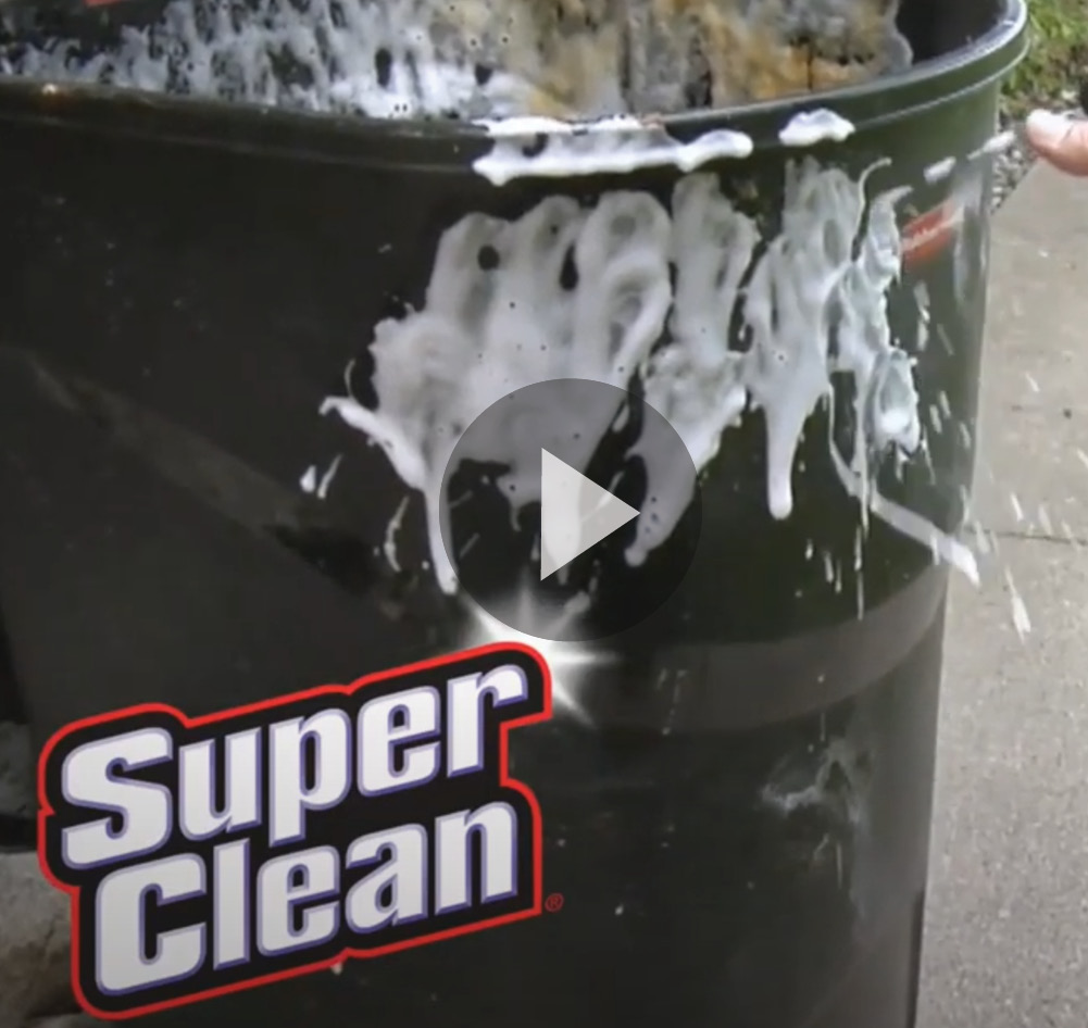 video still of cleaning a garbage can