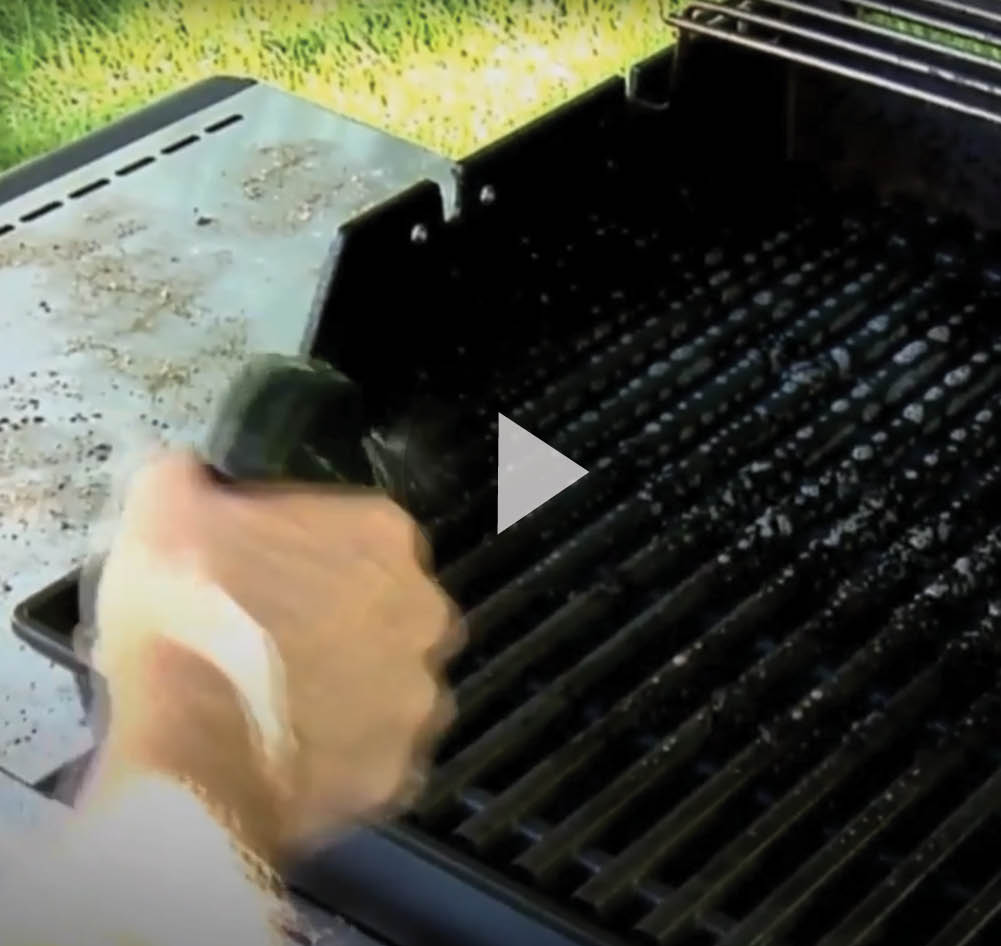 Still frame of video of cleaning grill with Super Clean