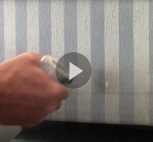 Still shot of video of upholstery cleaning with super clean